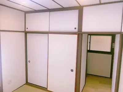 a row of white lockers in a room at miki I in Tokyo