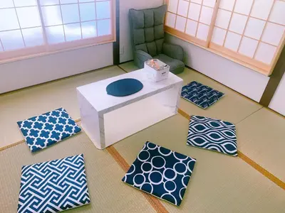 a room with a chair and a blue frisbee on the floor at miki I in Tokyo