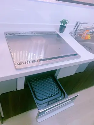 a white counter with a shelf in a kitchen at miki I in Tokyo