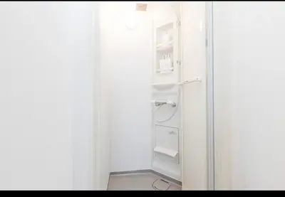 a white refrigerator with its door open in a room at Momo palace in Tokyo