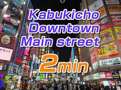 a busy city street with neon signs and buildings at \u30ec\u30b8\u30c7\u30f3\u30b7\u30e3\u30eb\u30b9\u30c6\u30fc\u30b8 in Tokyo