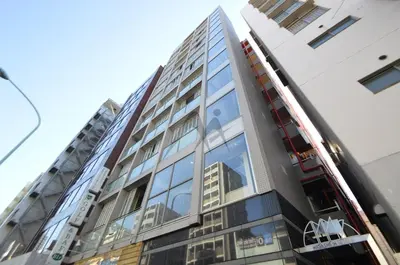 a tall building with glass windows on the side of it at \u30ec\u30b8\u30c7\u30f3\u30b7\u30e3\u30eb\u30b9\u30c6\u30fc\u30b8 in Tokyo
