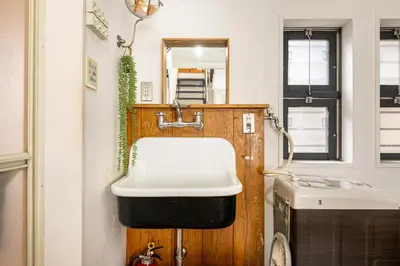 a bathroom with a sink and a toilet at Good Space Hotel Yoyogi in Tokyo