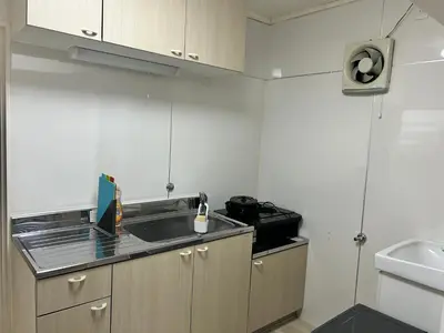 a kitchen with a sink and a counter top at Riverside Omori in Tokyo