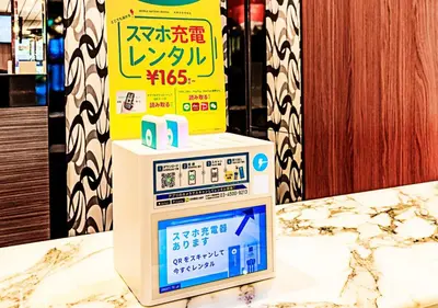a machine on a table with a sign on it at APA Hotel Kanda Jimbocho Ekihigashi in Tokyo