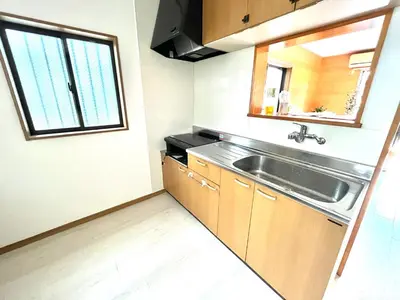 a small kitchen with a sink and a window at Tokyo log house with Free parking in Tokyo