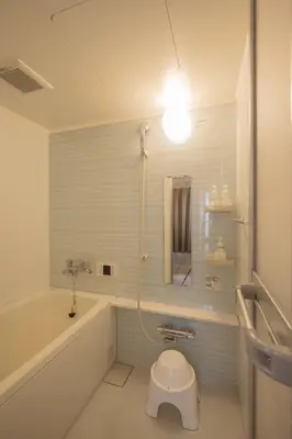a bathroom with a shower with a toilet and a sink at RY-Whole \u6d45\u8349\u3067\u5bb6\u65cf\u65c5 2\u5bdd\u5ba42\u6d74\u5ba4\u306e\u4e00\u68df\u8cb8\u5207 \u65e5\u672c\u4ebaSuperHost in Tokyo