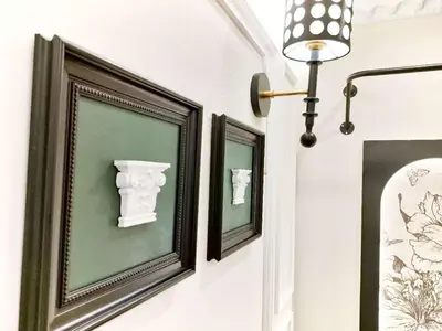 three framed pictures on a wall with a lamp at Z97- Shinjuku center 5 mins to st ation ,\u65b0\u5bbf\u6700\u4e2d\u5fc3 \u6771\u65b0\u5bbf\u7ad95\u5206 in Tokyo
