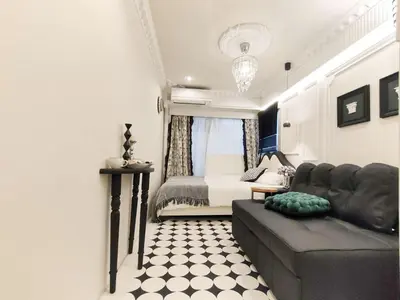 a living room with a couch and a bed at Z97- Shinjuku center 5 mins to st ation ,\u65b0\u5bbf\u6700\u4e2d\u5fc3 \u6771\u65b0\u5bbf\u7ad95\u5206 in Tokyo