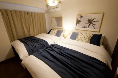 two beds in a hotel room with at NH building5F in Tokyo