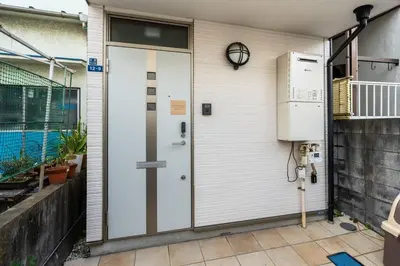 a front door of a house with a heater at \u30a2\u30f3\u30c9\u30b9\u30c6\u30a4\u5fd7\u83025\u4e01\u76ee in Tokyo