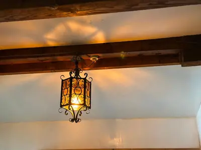 a chandelier hanging from the ceiling of a room at \u795e\u697d\u5742\u6238\u5efa\u3066\u30b5\u30a6\u30b9 in Tokyo