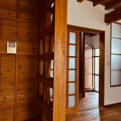 a room with wooden walls and a wooden door at \u795e\u697d\u5742\u6238\u5efa\u3066\u30b5\u30a6\u30b9 in Tokyo