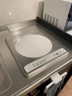 a bathroom counter with a white sink and a scale at Musashi's hotel IKEBUKURO2F in Tokyo