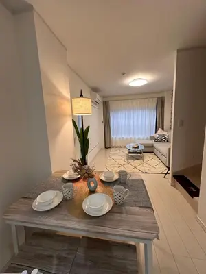 a living room with a table with plates on it at Relax House in Tokyo