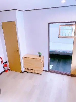 an empty room with a large window and a door at miki II in Tokyo