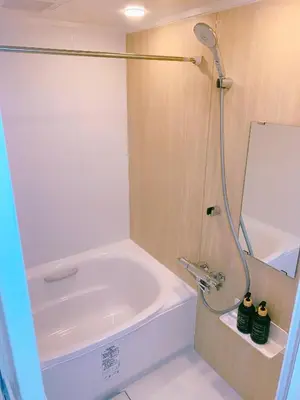 a bathroom with a bath tub and a shower at miki II in Tokyo