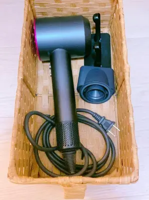 a blow dryer in a basket with a hose at miki II in Tokyo
