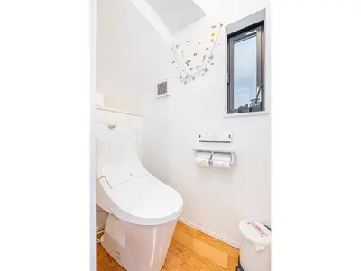 a bathroom with a toilet and a window at Ikebukuro Shopping Street 3BR in Tokyo