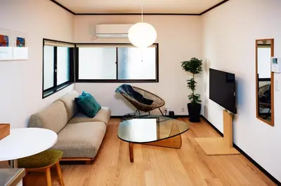 a living room with a couch and a table at 1stop to Shibuya station Japanese traditional house in Tokyo