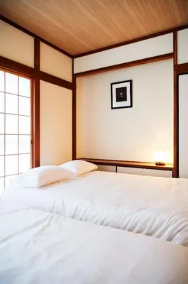 two white beds in a room with a window at 1stop to Shibuya station Japanese traditional house in Tokyo