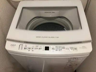 a washer and dryer in a bathroom at \u685cHome in Tokyo