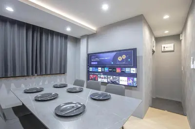 a conference room with a table and a tv at Walk to Kuramae Subway Stop EoYi in Tokyo