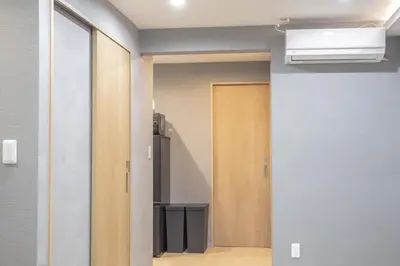 a hallway with a door leading into a room at Walk to Kuramae Subway Stop EoYi in Tokyo