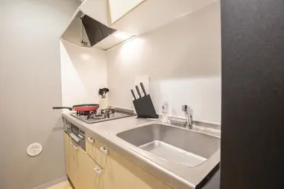a kitchen with a sink and a stove at Walk to Kuramae Subway Stop EoYi in Tokyo