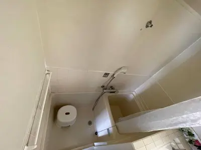 a bathroom with a toilet and a shower at Local Stay NAKAI in Tokyo