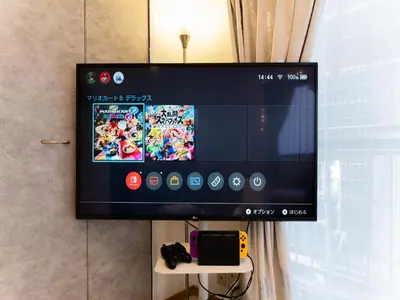 a flat screen tv hanging on a wall at Shinjuku, Hatsudai Sta 7min walk,PS5,Switch,Wi-Fi in Tokyo