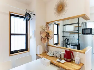 a kitchen with a counter and a mirror at Shinjuku, Hatsudai Sta 7min walk,PS5,Switch,Wi-Fi in Tokyo