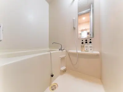 a white bathroom with a shower and a sink at Shinjuku, Hatsudai Sta 7min walk,PS5,Switch,Wi-Fi in Tokyo