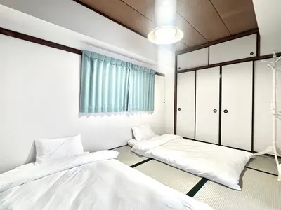 a room with two beds and a window at AX-Ikebukuro 601-TS0177 in Tokyo