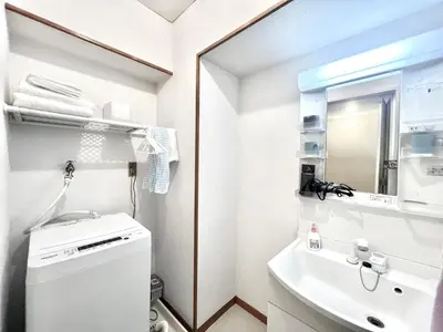a small bathroom with a sink and a mirror at AX-Ikebukuro 601-TS0177 in Tokyo