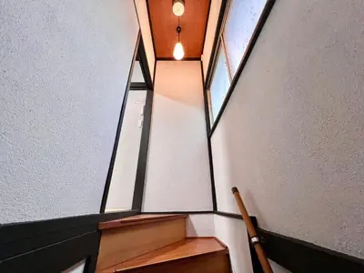 a room with two windows and a stair case at AX-Ojima House-KT0175 in Tokyo