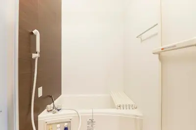 a small bathroom with a sink and a toilet at Fiore Kinshicho by Tranova in Tokyo