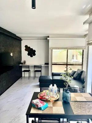 a living room with a couch and a table at ATW Tokyo Near the station Close to Asakusa Airport For infants and toddlers in Tokyo