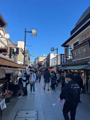 a group of people walking down a street in a market at ATW Tokyo Near the station Close to Asakusa Airport For infants and toddlers in Tokyo