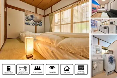 a hotel room with two beds and a window at NEW\uff01\u8cb8\u5207\u30a2\u30d1\u30fc\u30c8\uff12DK\uff14\uff14\u33a1\u3000\u99c5\uff12\u5206\u6e0b\u8c37\u99c5\u96fb\u8eca\uff11\uff15\u5206\u3000\u30b3\u30f3\u30d3\u30cb\u516c\u5712\uff15\u79d2D\u30d9\u30c3\u30c9\uff13\u53f0\u9ad8\u901fWIFI in Tokyo