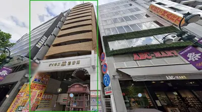 a tall building in front of a building at Dainess Ichibankan Shibuya in Tokyo