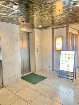a room with a sign in the middle of a building at Dainess Ichibankan Shibuya in Tokyo