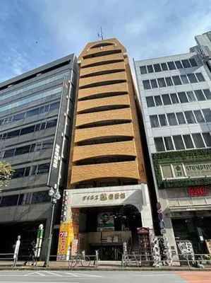 a tall building in a city with two tall buildings at Dainess Ichibankan Shibuya in Tokyo