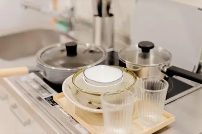 a kitchen counter with a tray with dishes and a pot at Mi-HOTEL CALM RIVERSIDE in Tokyo