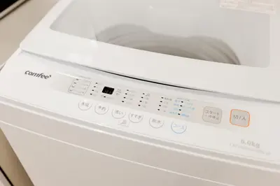 a white washing machine with its door open at Mi-HOTEL CALM RIVERSIDE in Tokyo