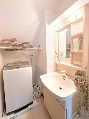 a white bathroom with a sink and a mirror at Shinkoiwa Stay, Private House, Nearby Station, Good access to Ueno&Asakusa in Tokyo