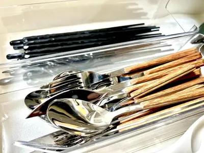 a group of spoons and forks and knives in a drawer at Shinkoiwa Stay, Private House, Nearby Station, Good access to Ueno&Asakusa in Tokyo