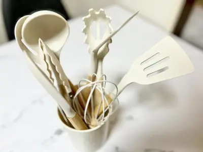 a cup filled with utensils on a table at Shinkoiwa Stay, Private House, Nearby Station, Good access to Ueno&Asakusa in Tokyo