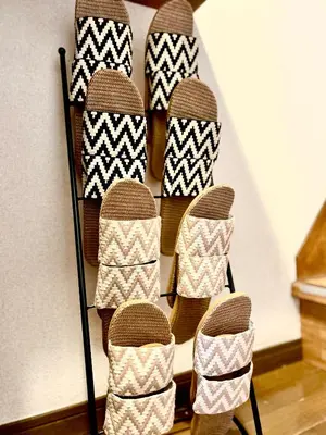 a group of shoes on a rack in a room at Shinkoiwa Stay, Private House, Nearby Station, Good access to Ueno&Asakusa in Tokyo