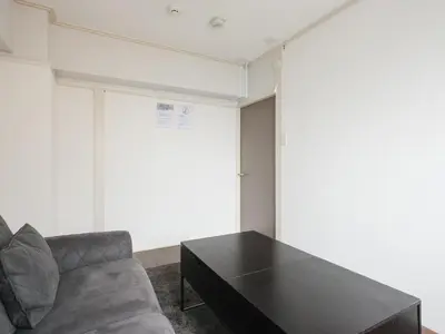 a living room with a couch and a table at Hatagaya heim 403 in Tokyo